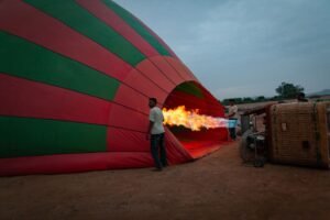 Colorful hot air balloon being inflated at sunrise in Marrakesh, Morocco