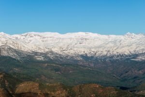 Snow-capped Atlas Mountains under a clear blue sky, Morocco