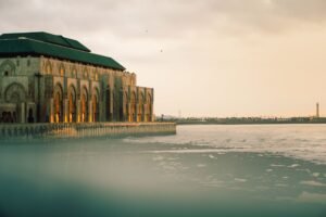 The Hassan II Mosque at sunset by the sea, Casablanca