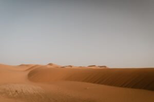 Expansive golden sand dunes of the Sahara Desert near Merzouga, Morocco