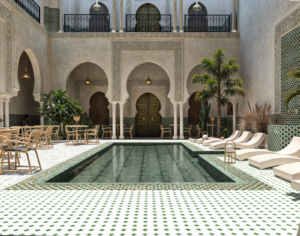 A traditional riad courtyard in Morocco, with rooms opening onto a central pool