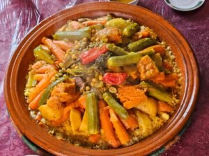A traditional Moroccan vegetable tagine served over couscous
