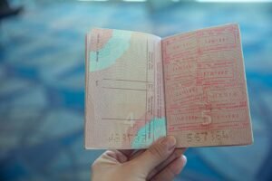 A passport with entry stamps, held ready for international travel