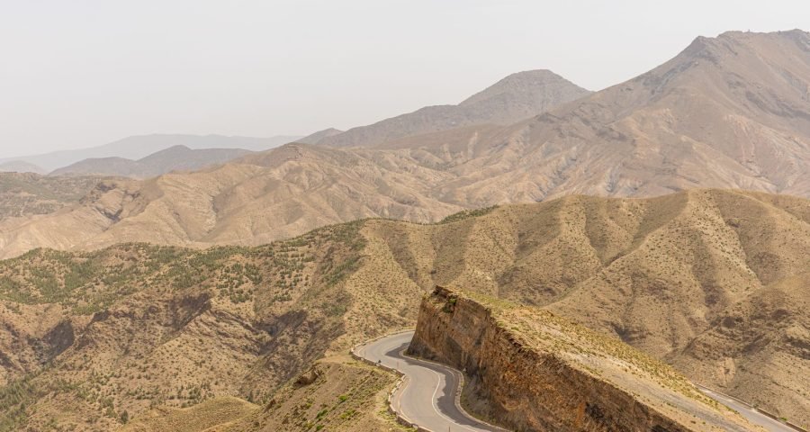 Winding road traversing the rugged Atlas Mountains between Marrakech and Merzouga