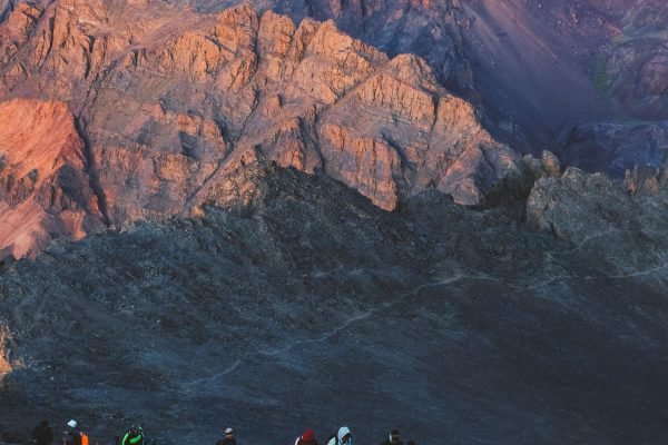 Hikers on a remote mountain trail in the Moroccan Atlas Mountains