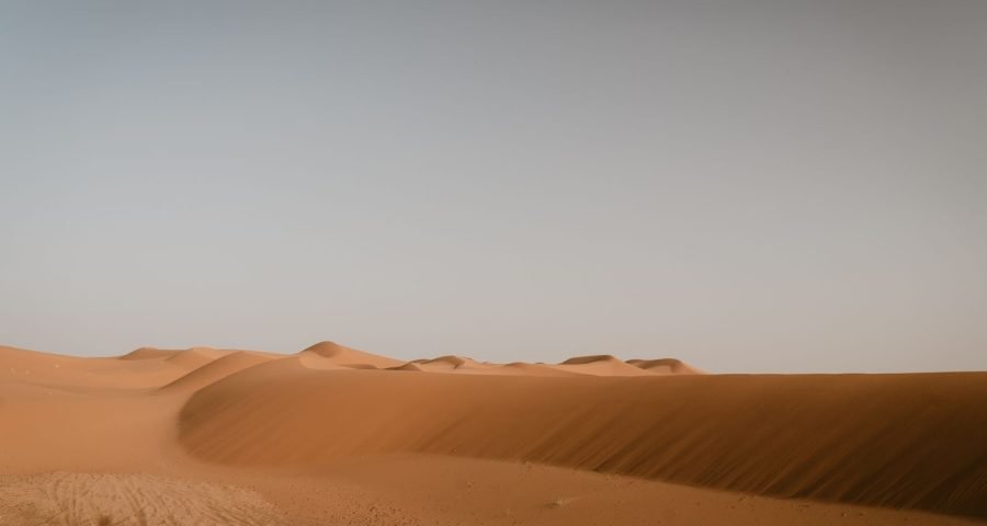 Expansive golden sand dunes of the Sahara Desert near Merzouga, Morocco