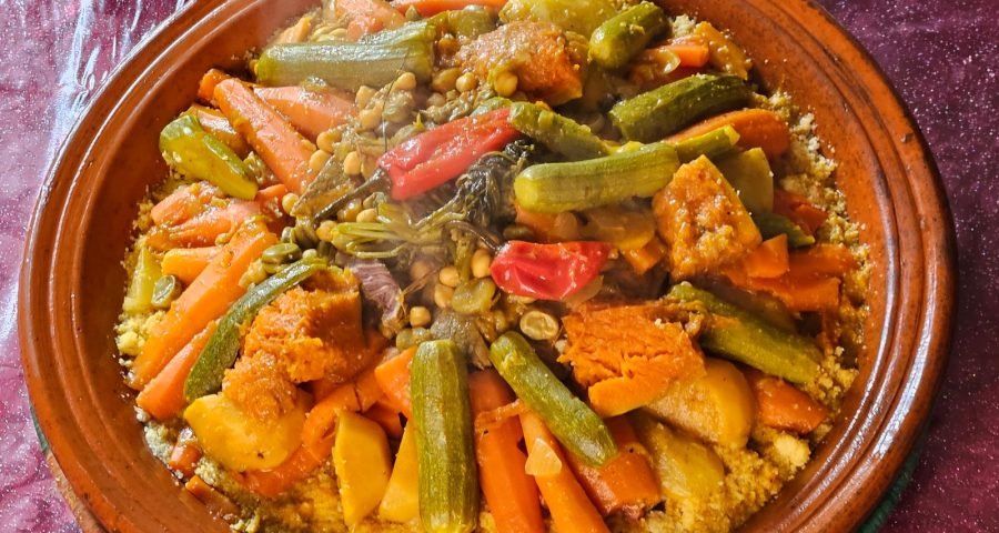 A traditional Moroccan vegetable tagine served over couscous