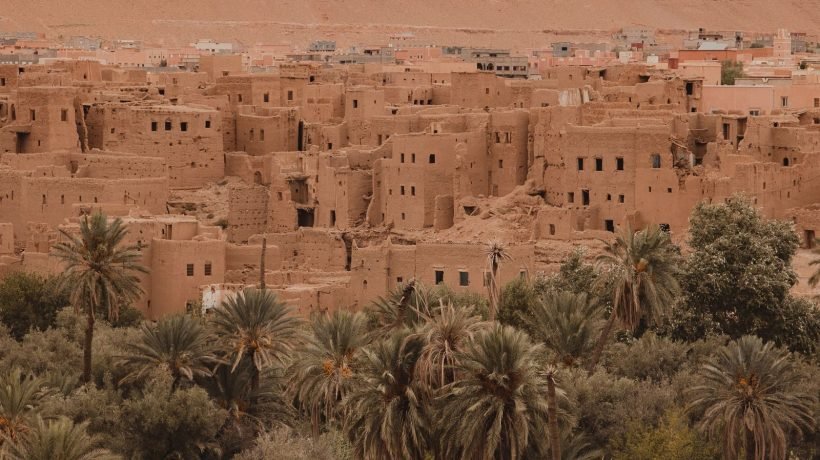 A Moroccan kasbah under a clear blue sky on the Casablanca Grand Tour