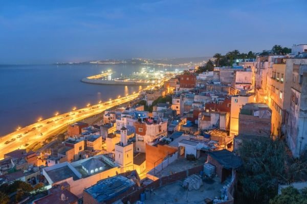Tangier city skyline at sunset overlooking the Moroccan coast and bediterranean Sea