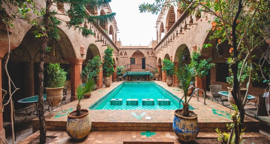 Traditional Moroccan riad courtyard with a pool, a safe and comfortable place to stay while traveling solo